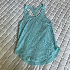 Teal colored tank top. Size XS.